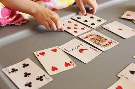 Games to play with playing cards. Playing Trash A Fun Kids Card Game 4 Little Fergusons