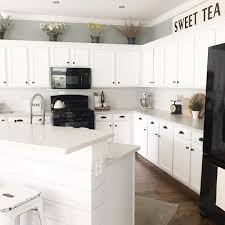9 Ways To Decorate Above Your Kitchen Cabinets