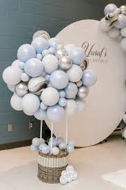 9 Essentials For An Awesome First Birthday Party Birthday Balloon Decorations Baby Shower Balloons First Birthday Party Decorations