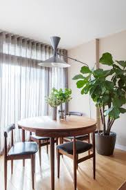 Indoor Planting Idea Dining Room Wood Floor Pot Plants Dining Chairs Table Lamp Window Curtain O Dining Room Design Living Room Plants Transitional Dining Room