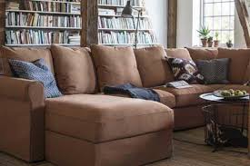 A Brown Gronlid Sofa In A Rustic Living Room With A Library Of Books Behind It Rustic Home Decor Cheap Rustic Shabby Chic Decor Rustic Decor