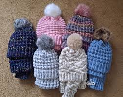 Cozy wool accessories including scarves beanies gloves and socks