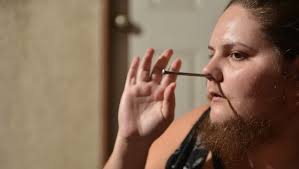 Gallery: Woman finds acceptance after growing beard