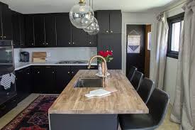 Shiplap walls, black cabinetry, and beautiful, butcher block countertops in acacia wood are the winning trio in this modern farmhouse inspired kitchen featured on black walls and a matching island instantly makes the oak butcher block counters in this kitchen appear fresh and modern. How To Install Diy Butcher Block Countertops With Undermount Sink