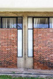 Maybe you would like to learn more about one of these? File Eiabc Library Exterior Wall Showing The Use Of Natural Surface Finishes Brick Concrete Mosaic Jpg Wikimedia Commons