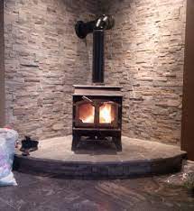 Wood burning stove in basement. Stone And Old Wood Stove In Our Basement Mike Built And Installed We Love It Wood Stove Wood Stove Hearth Old Wood Stove