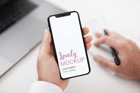 Download Mockup Of A Man Holding An Iphone 11 While Working Iphone 11 Iphone Screen Iphone