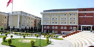 The i̇stanbul aydın üniversitesi logo contains a number of different shapes, including 641 squares, 28 stars and 338 circles. Istanbul Aydin University Ok Tamam Group
