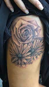Thigh Tattoo Daisies Roses Names Tattoo Ink Black And Grey Roses Daisies Thigh Love It Tattoos Rose Tattoo Thigh Thigh Tattoo