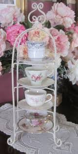 Unique design 4 of your favorite teacups and saucers can be elegantly displayed with this lovely holder. Pin On Tea Cup And China