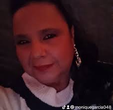 A woman was sent to the hospital Thursday morning after being struck by a  vehicle as she stood near her front driveway