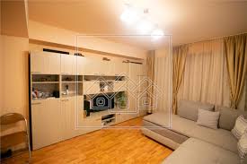 Apartamentul este compartimentat decomandat si este compus din 2 camere, 1 bucatarie, 1 baie, hol, 1 ba. Apartament De Vanzare In Sibiu 2 Camere Decomandate Vasile Aron New Concept Living 8811
