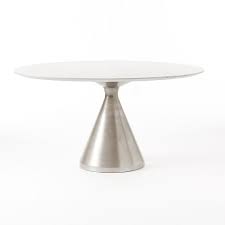 Coffee tables with simple silhouettes help anchor seating ensembles without adding too much weight. Silhouette Pedestal Oval Dining Table White Marble Brushed Nickel