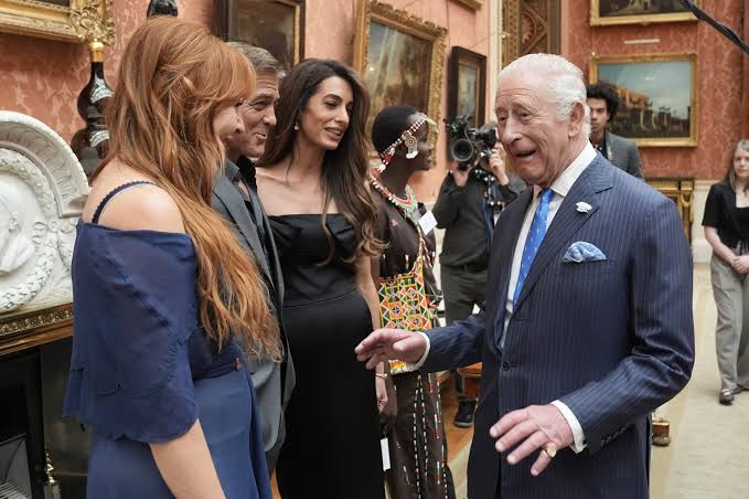 King Charles III greets George and Amal Clooney at Buckingham Palace: See  the photos - ABC News