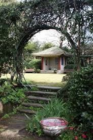 I Do Love One Other Feature Of Eryldene Camellia Flowers Floated In Bowls Of Water Throughout The Garden Gate Design Moon Gate Backyard Landscaping Designs