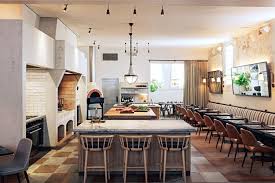 Large round tables draped with white linen are neatly set, blending in with neutral classics of chocolate wood trimmings and beige walls. 10 Restaurants That Will Defy Expectation