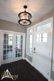 Warm And Inviting Foyer Wall Color Is Benjamin Moore S Stone Harbour 2111 50 Foyer Colors Farmhouse Foyer Brick Decor