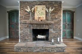 The stone fireplace below is filled with horizontally oriented stones that one way to add variety to a stacked stone fireplace without hanging artwork? Various Ideas Of Stacked Stone Fireplace Based On Your Available Budget Artmakehome
