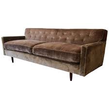 Whether you're stretching out after a long day at work, enjoying a movie night, or engaging in a discussion with your friend, this sofa supports the sweet time of being. Baker Furniture Midcentury Tufted Brown Velvet Sofa At 1stdibs