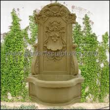 Mosaic beige retaining wall with mossy fieldstone on both sides of the waterfall. China Simple Design Garden Stone Marble Sandstone Wall Fountain For Outdoor Sy W199 China Water Fountain And Outdoor Fountain Price
