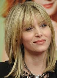 This shorter style with layers is the perfect wash and go haircut. Short And Medium Hairstyles Women Over 40
