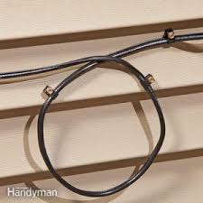 Secure the cable to the overhead joists with cable staples. How To Rough In Electrical Wiring Diy Family Handyman