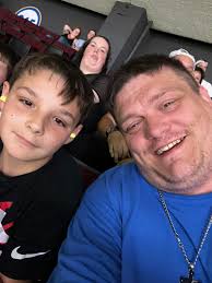 Please help!!! Can someone edit this person in the background out from my  hubby and sons photo