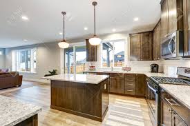 Add flair to your cooking with amara. Light Filled Northwest Kitchen Design With Kitchen Island Natural Brown Cabinets Topped With Granite Countertops And Paired With White Backsplash Northwest Usa Stock Photo Picture And Royalty Free Image Image 89853513