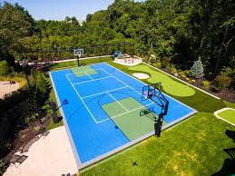 The garden supplies a secluded location for children to play in private. Versacourt Home Backyard Basketball Court Photos