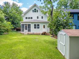 This Old North Durham Dacian delight was custom crafted by Gail Crabtree in  2017. The home boasts 4 bedrooms and an open-concept main floor. The modern  kitchen, cozy living room with fireplace