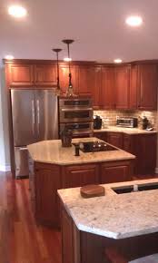 Kitchen Cabinet With Two Islands Homecrest Cabinets Jamison Door Cherry Wood Autumn Fi Cherry Cabinets Kitchen Kitchen Pantry Cabinets Cherry Wood Cabinets