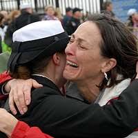 Senior Airman Jason M. Cullen receives a hug from his