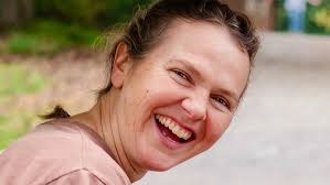 Corinne Wilkinson calls the dance “Un! Deux! Trois! Poussez!” at the John  C. Campbell Folk School