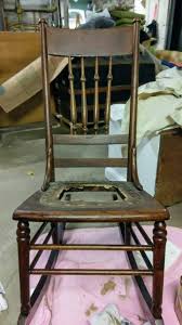 a leather seat in an antique chair