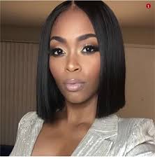 The hair is chopped off the same size at the back and is slightly longer at the sides. Middle Part Black Bob Hairstyles Black Women On Stylevore