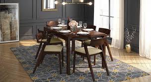 The extendable round table have prime qualities and discounts that give you value for money. Vanalen 4 To 6 Extendable Thomson 6 Seater Glass Top Dining Table Set Urban Ladder