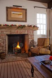 brick fireplace and plaid chair
