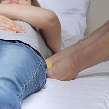 Pivot to a sitting position in bed, supporting her head. Turning Sling For Placing And Supporting People In Sideways Positions Guldmann International