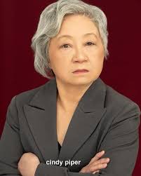 It's elementary that Cindy Piper keeps booking. This time booking a fun  role