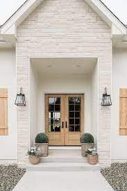 8 Modern Farmhouse Exteriors That Channel The Best Of Both Worlds Hunker Dream House Modern Farmhouse Exterior House Exterior