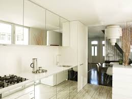 That's why we love the idea of incorporating them into a small kitchen to make the space feel roomier. 5 Smart Ways To Use Mirrors In A Small Home Or Apartment