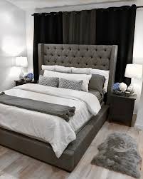 A small and minimalist attic bedroom done in moody blues and with teal and turquoise bedding. Master Bedroom Grey Upholstered Bed Novocom Top