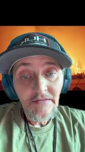 Guy with Fan in Backyard about Wild Fires