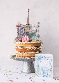 Would you describe the decorations as modern, dated, or something else? Paris Cake Topper And Confetti The House That Lars Built