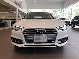 Front End View Of An Ibis White 2018 Audi A4 With Grill Logo And Headlights Located At Audi Of Bridgewater Nj Audi Dealership Luxury Cars Audi