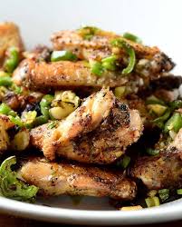 Crispy Baked Salt And Pepper Chicken Wings Tossed With Garlic Jalapenos Green Chicken Wing Recipes Chicken Stuffed Peppers Stuffed Peppers