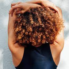 Studio portrait on a dark background background. Curly Hair Types Chart How To Find Your Curl Pattern Allure