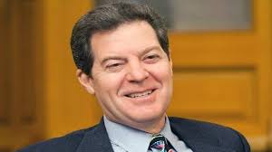 Brownback 'riding backward into the future'