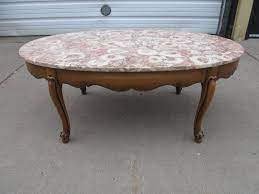 These antique marble top coffee table are. Nice Vintage Oval Marble Top Coffee Table Little Canada Estate Auction Antiques Collectibles More K Bid