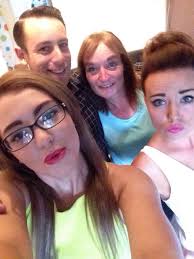 Hey you wonderfully clever people. Can anyone remove the boy in the white  T-shirt behind the dog please. The photograph is my mum's 80th birthday  present and he is no longer our